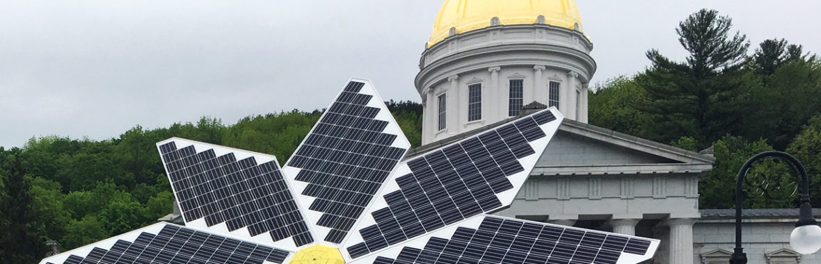 Flower shaped solar panel in front of a state building